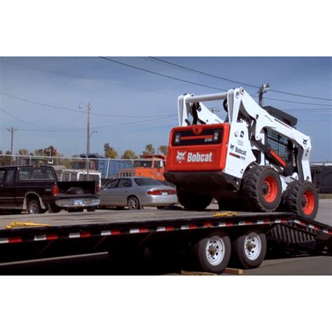 transporting skid steer|operating a bobcat skid steer.